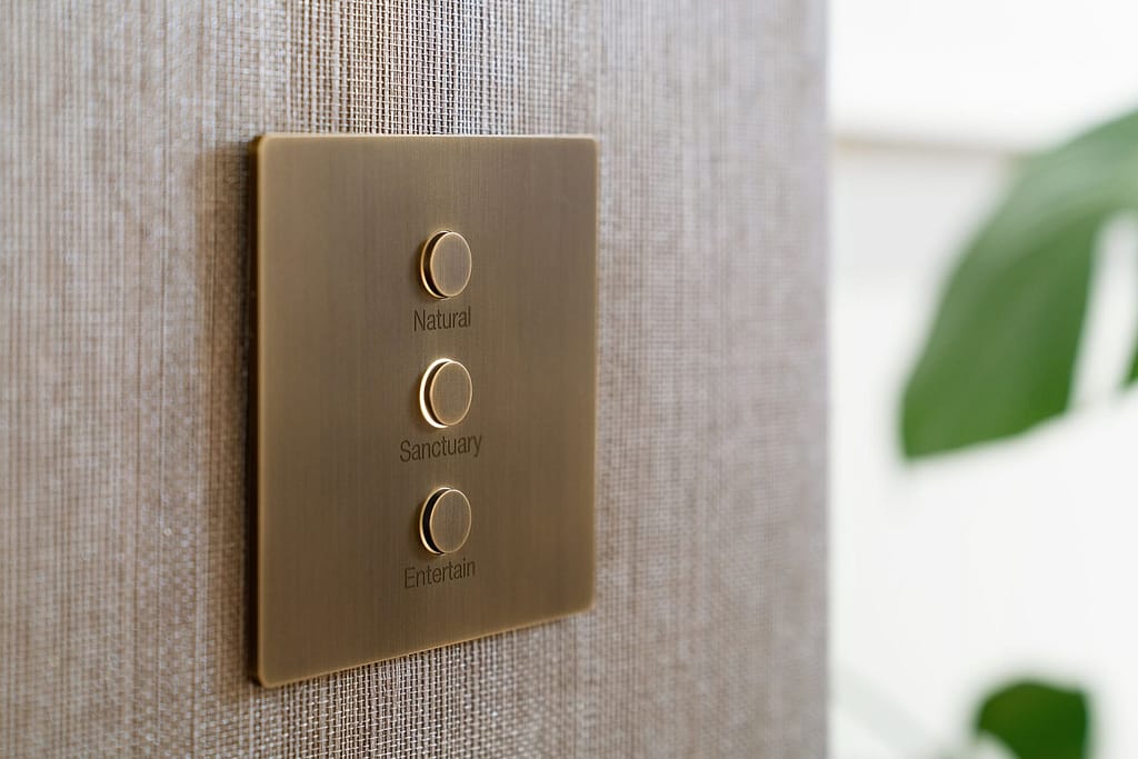 Alisse wall control with 3 buttons: 'Natural, Sanctuary & Entertain'